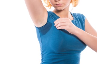 Woman with a sweaty armpit